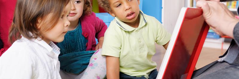 children listen to storybook read aloud