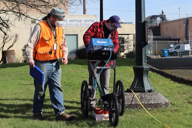 Ground penetrating radar operators from the Confederated Tribes of the Grand Ronde scan a location identified as part of the Oregon Indian Mission Manual Labor School urban archaeology project. (Used with permission.)