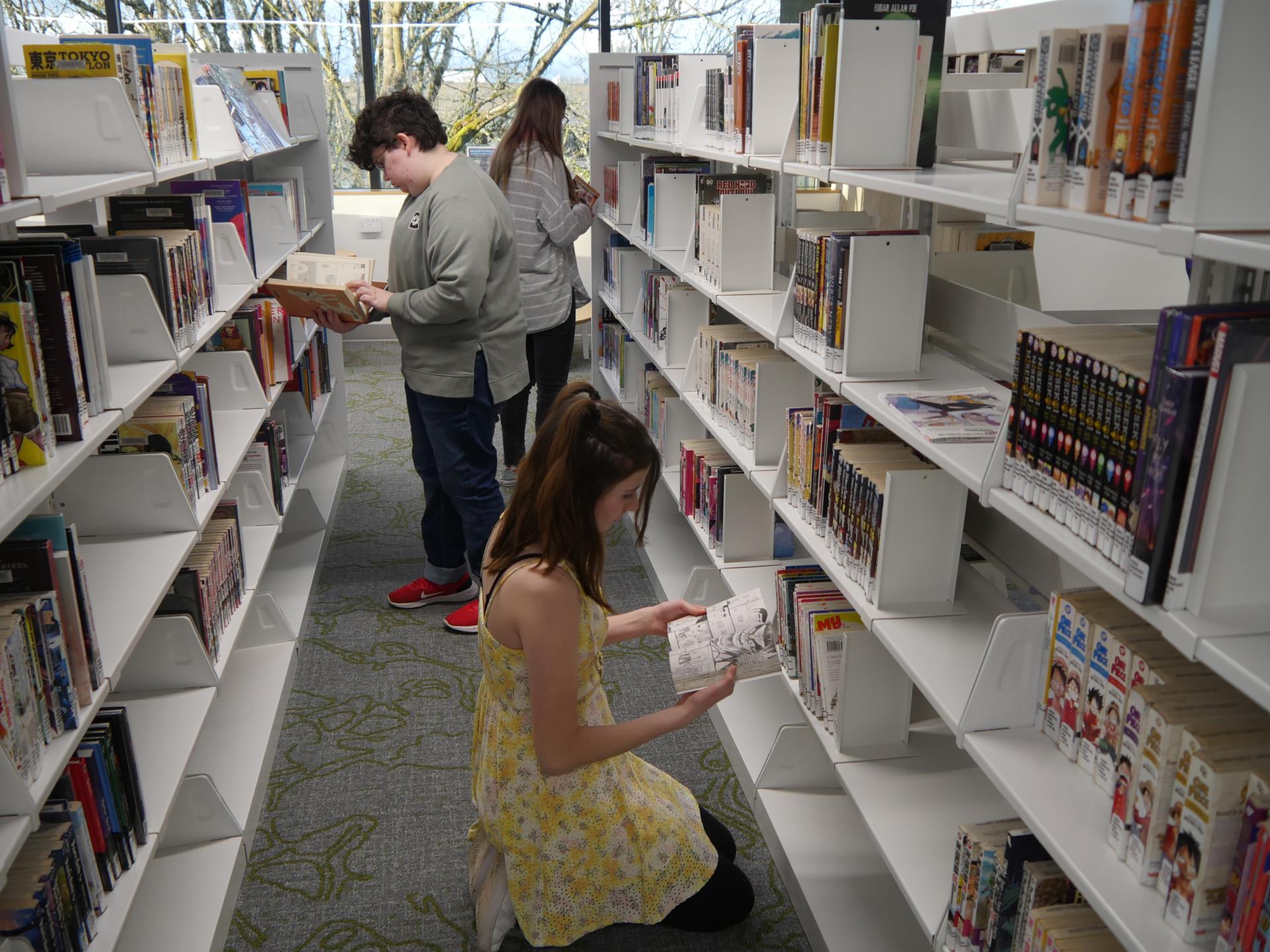 Teens browse graphic novels in Teen Scene at Salem Public Library