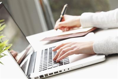 woman hands writing typing laptop