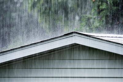 summer rain storm downpour pounding on roof