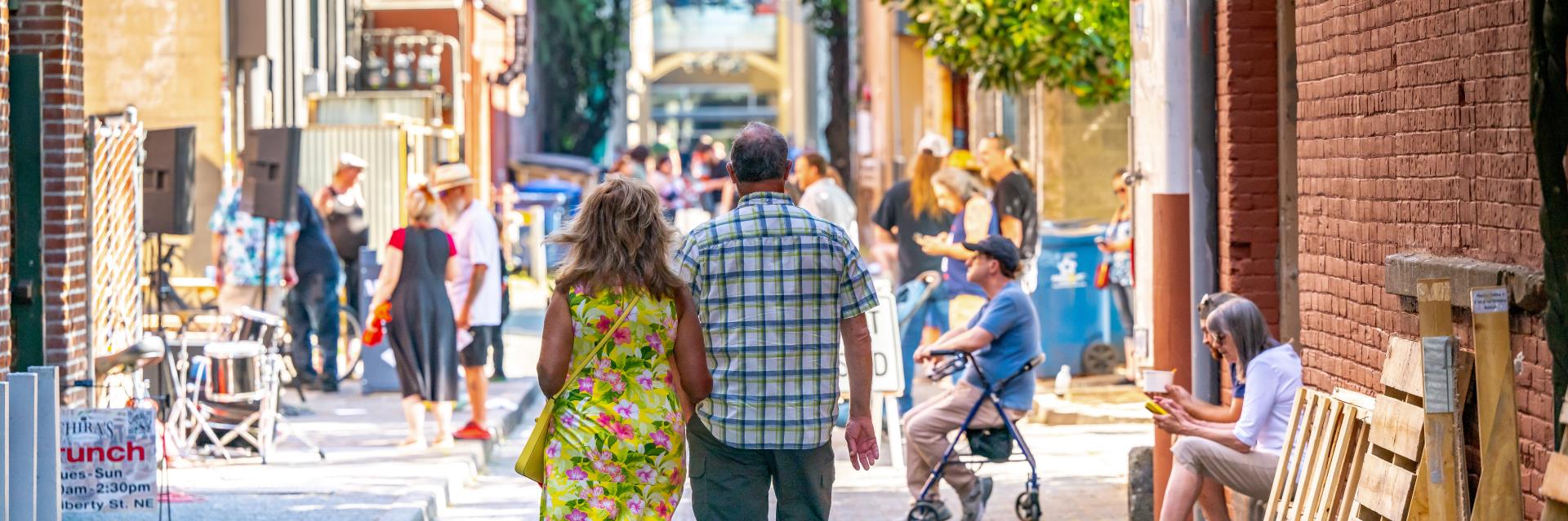 Couple Walking through Alley at Make Music Day