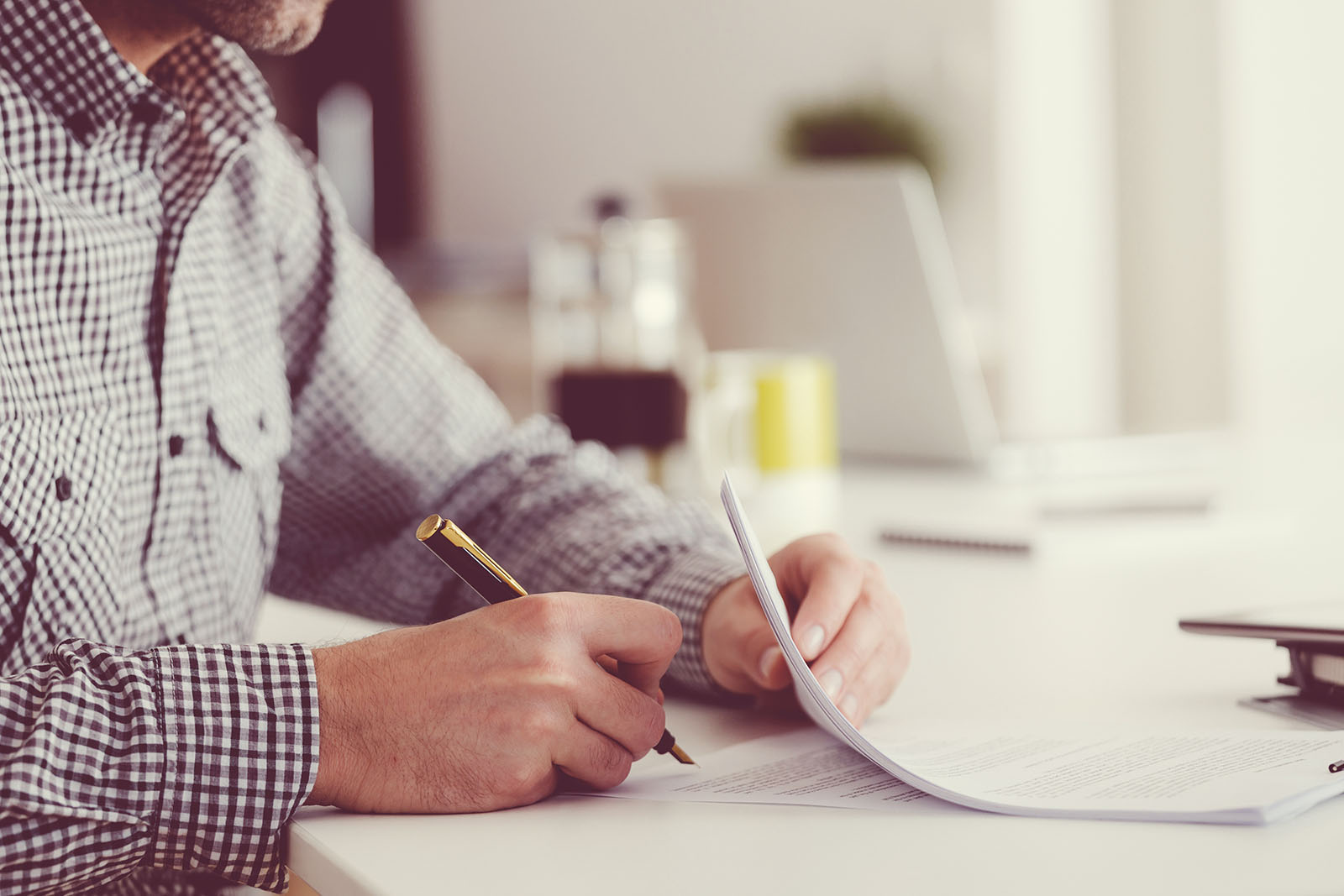 Man at Table Filling out Paperwork